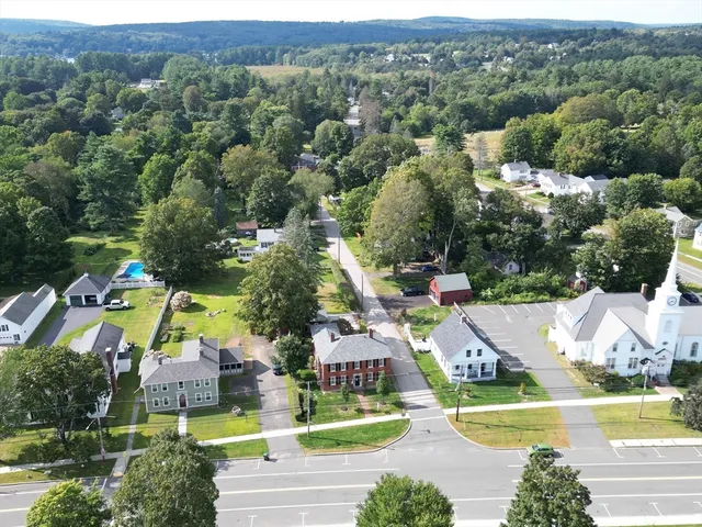 a front view of a house with garden and porch
