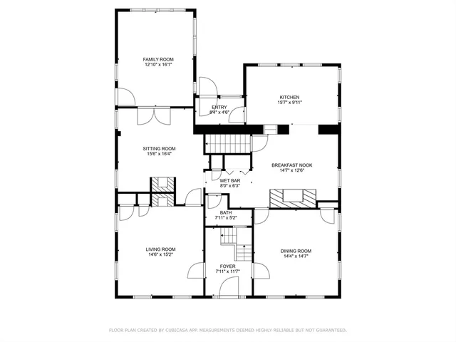 a picture of a bench in front of a wall