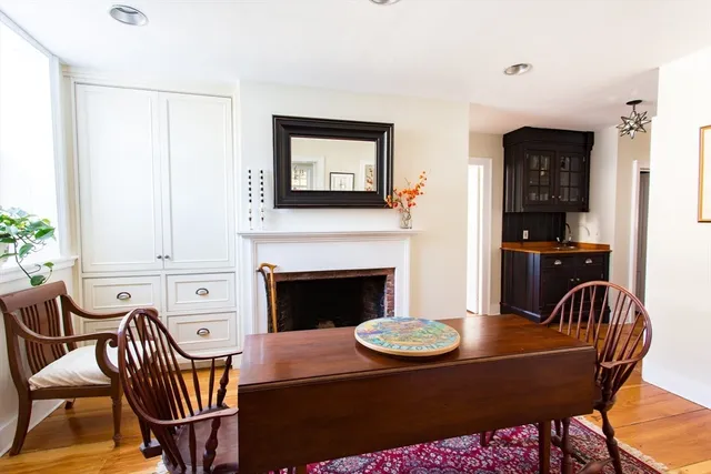 a kitchen with a stove and a wooden cabinets