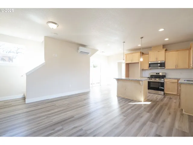 a view of kitchen with wooden floor