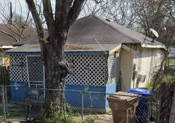 a front view of a building with retail shops