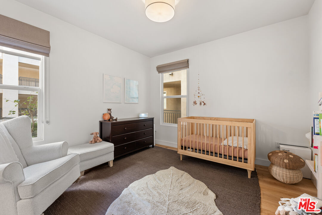 6020 South Seabluff Drive, Unit 131 Playa Vista, CA 90094 - Photo 17 of 30 a bedroom with furniture and a window