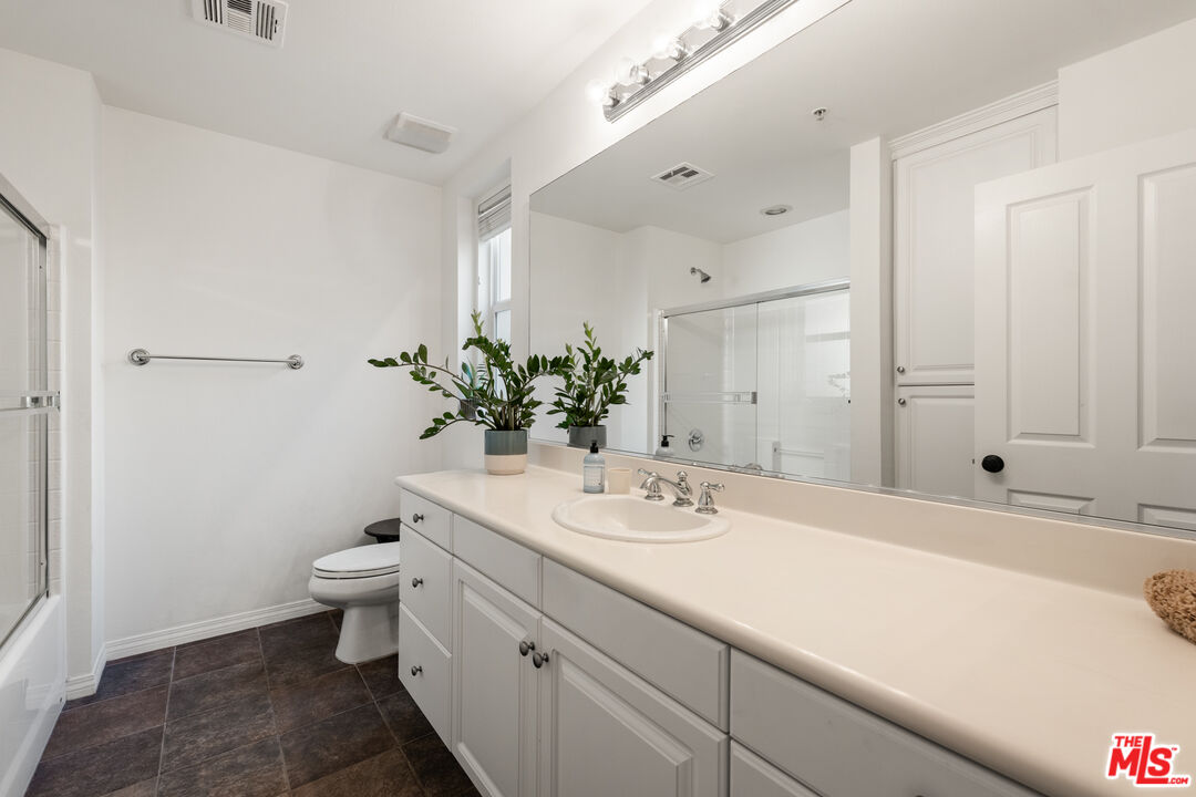 6020 South Seabluff Drive, Unit 131 Playa Vista, CA 90094 - Photo 21 of 30 a bathroom with a sink and a mirror