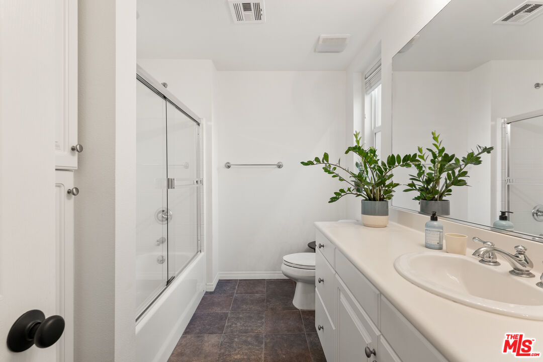 6020 South Seabluff Drive, Unit 131 Playa Vista, CA 90094 - Photo 22 of 30 a bathroom with a sink a toilet and shower
