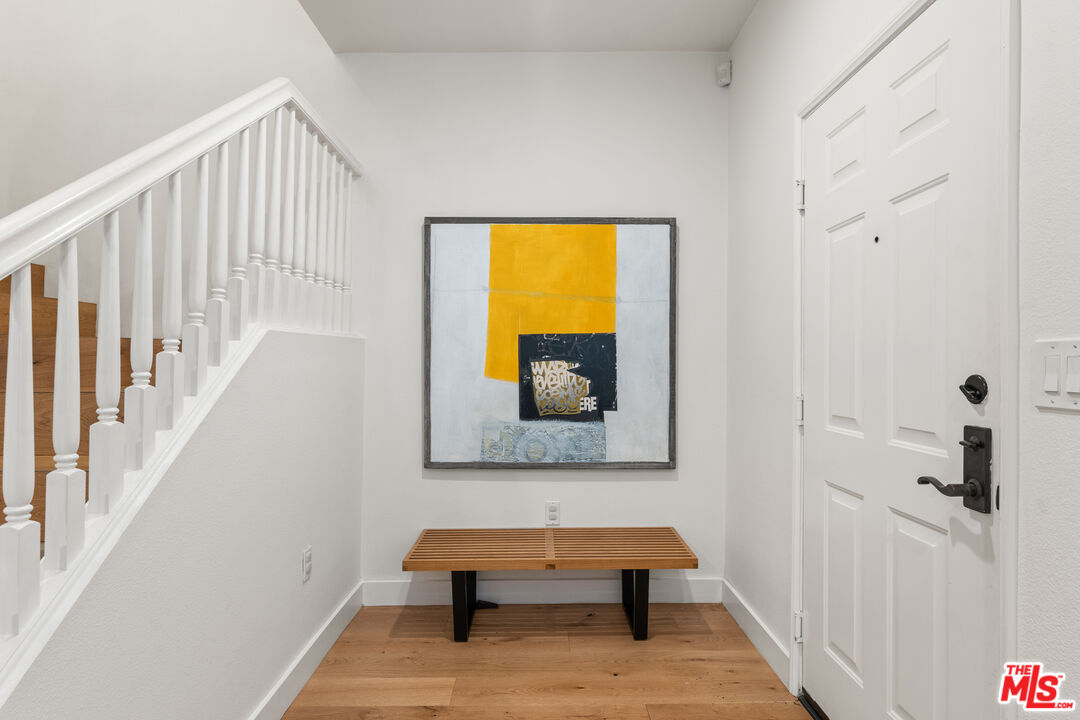 6020 South Seabluff Drive, Unit 131 Playa Vista, CA 90094 - Photo 23 of 30 a view of a room with wooden floor and windows