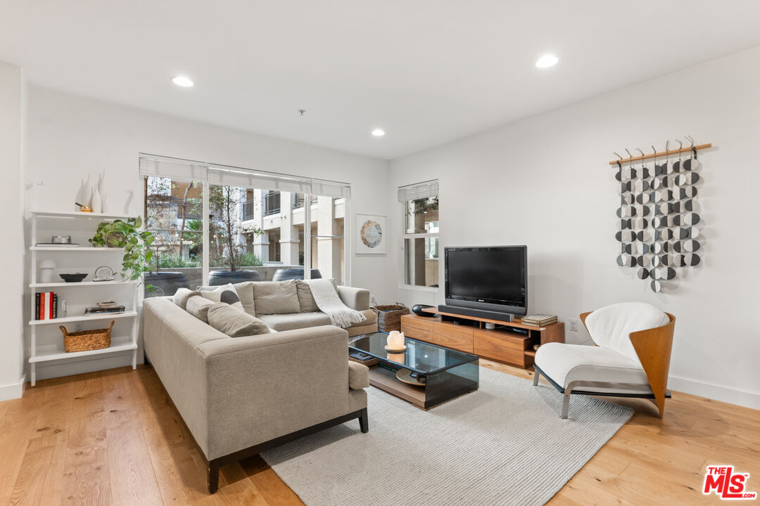 6020 South Seabluff Drive, Unit 131 Playa Vista, CA 90094 - Photo 3 of 30 a living room with furniture and a flat screen tv