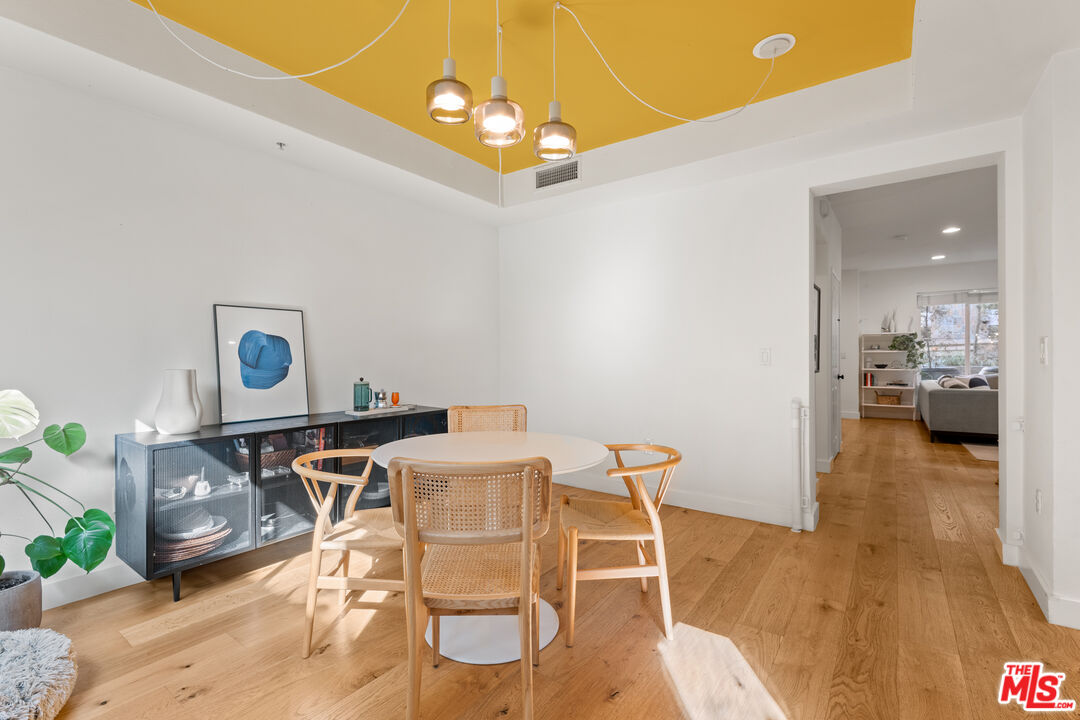 6020 South Seabluff Drive, Unit 131 Playa Vista, CA 90094 - Photo 7 of 30 a view of a dining room with furniture and wooden floor
