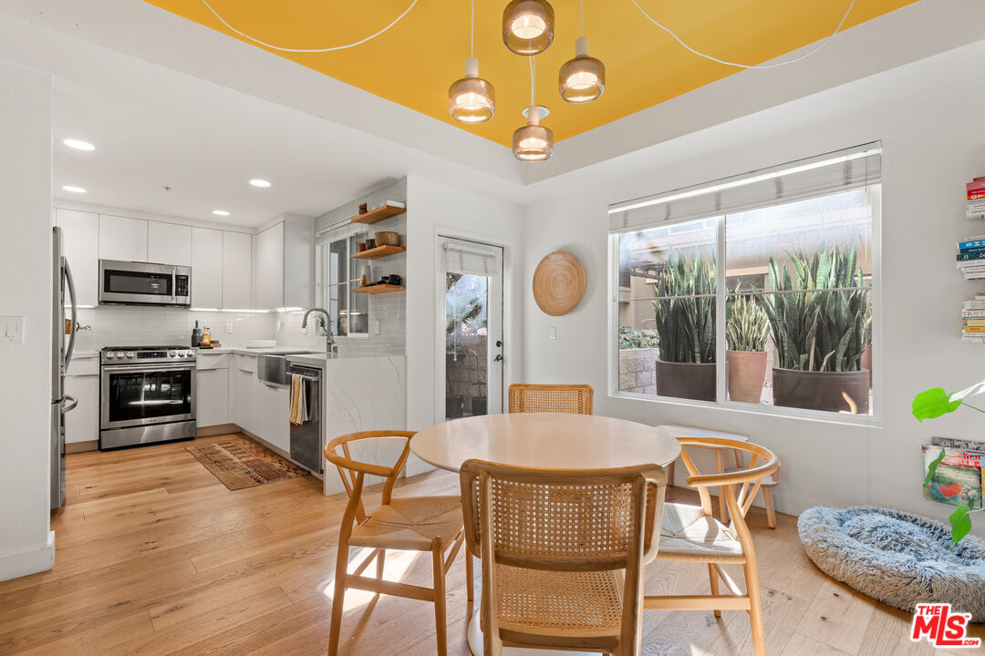6020 South Seabluff Drive, Unit 131 Playa Vista, CA 90094 - Photo 9 of 30 a view of a dining room with furniture and wooden floor