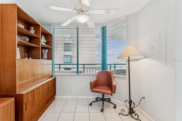 a kitchen with stainless steel appliances granite countertop a refrigerator a sink dishwasher a stove and white countertops with wooden floor