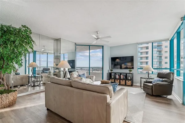 a living room with furniture and a flat screen tv