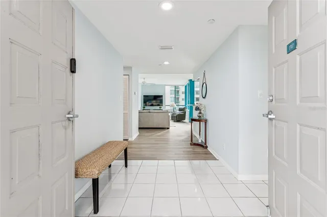 a view of a kitchen with cabinets and wooden floor