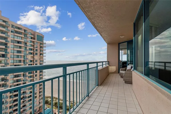 a bedroom with a large bed and a large window