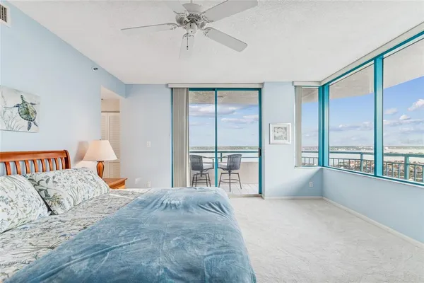 a bathroom with a granite countertop sink a mirror and a shower