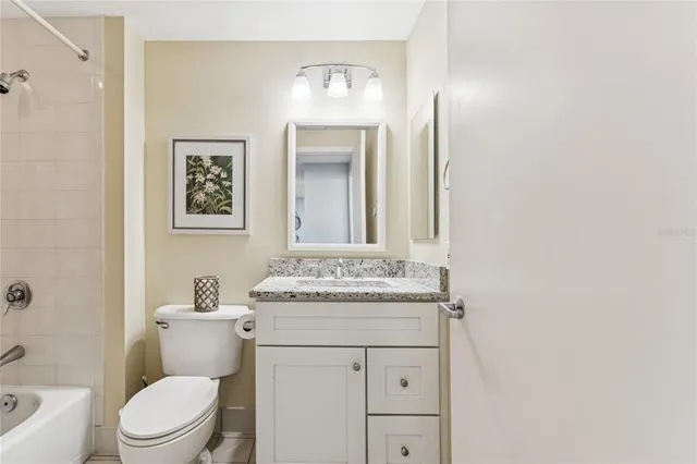 a bedroom with a bed and a lamp