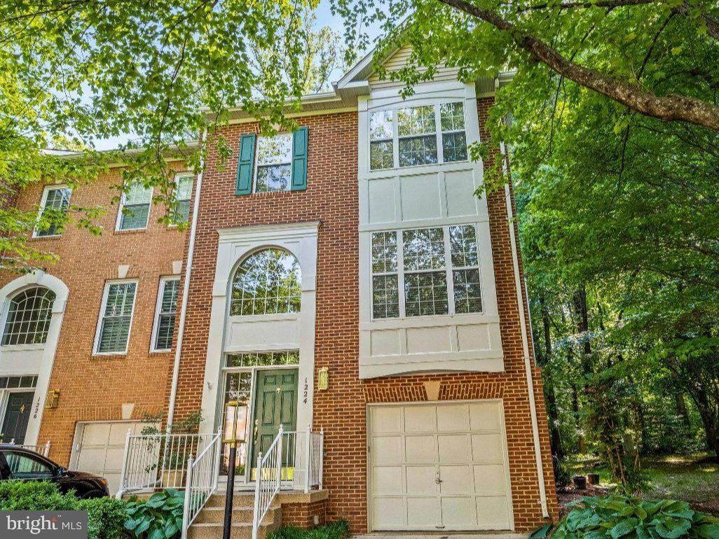1224 Wild Hawthorn Way Reston, VA 20194 - Photo 2 of 3 Charming brick townhouse in nature's embrace.