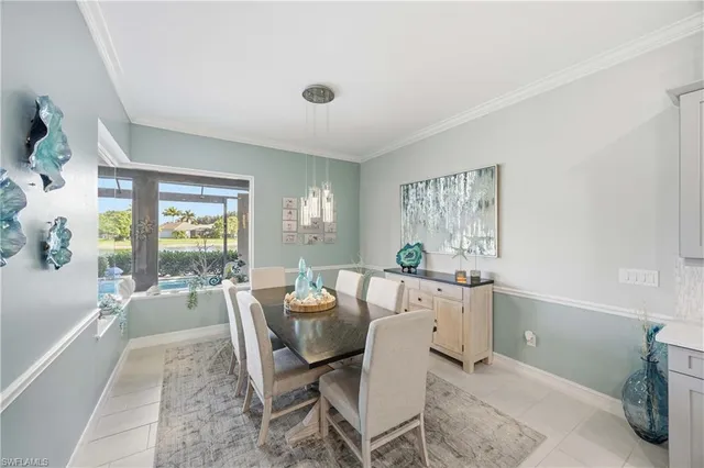 a living room with furniture a large window and dining table