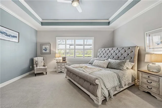 a spacious bedroom with a bed and a couch