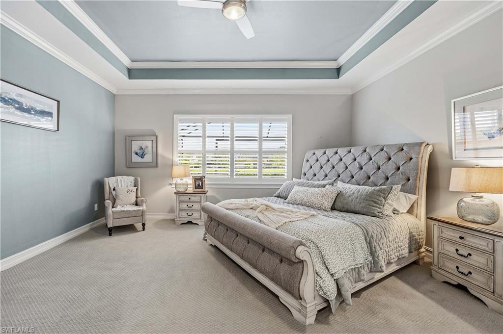 14748 Windward Lane Naples, FL 34114 - Photo 13 of 47 a spacious bedroom with a bed and a couch