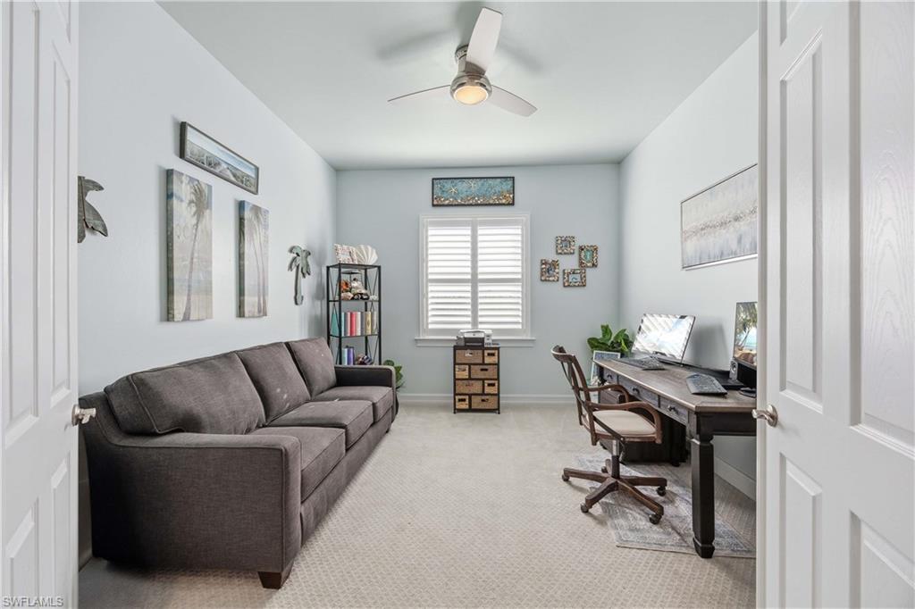 14748 Windward Lane Naples, FL 34114 - Photo 17 of 47 a living room with furniture and a window