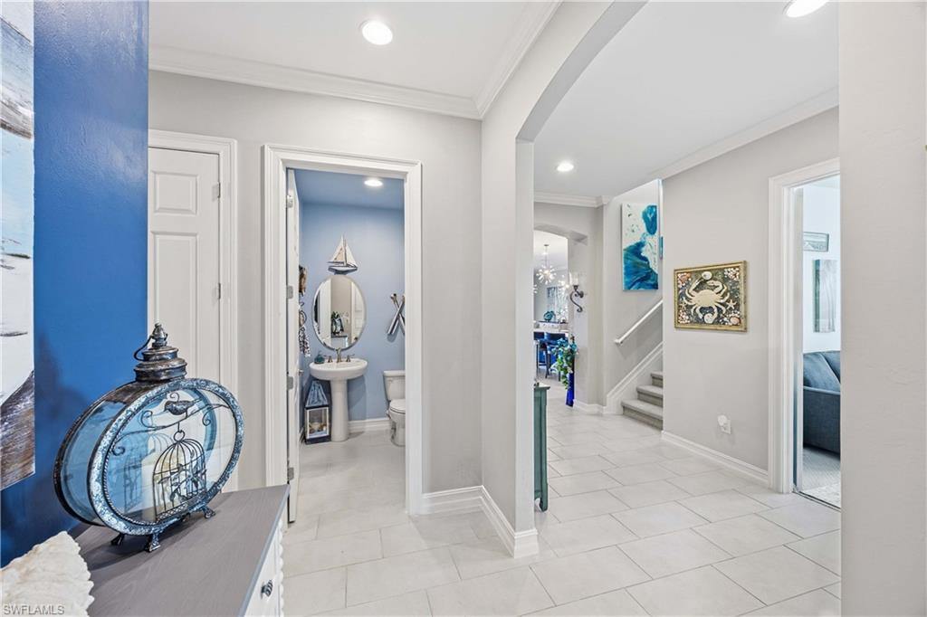 14748 Windward Lane Naples, FL 34114 - Photo 20 of 47 a view of an entryway with wooden floor