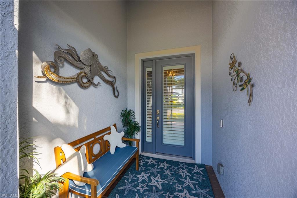 14748 Windward Lane Naples, FL 34114 - Photo 2 of 47 a living room with furniture and a window
