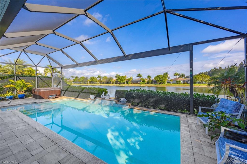 14748 Windward Lane Naples, FL 34114 - Photo 30 of 47 a view of a swimming pool with a patio