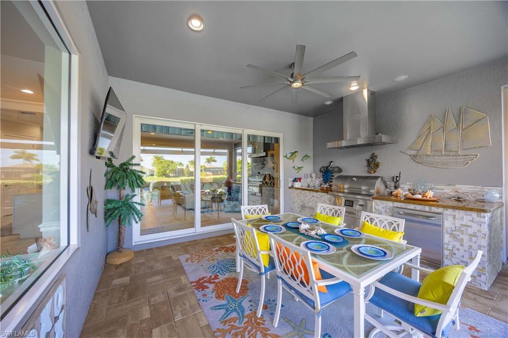 14748 Windward Lane Naples, FL 34114 - Photo 32 of 47 a living room with stainless steel appliances furniture and a table
