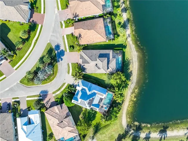 an aerial view of a house with a yard and garden