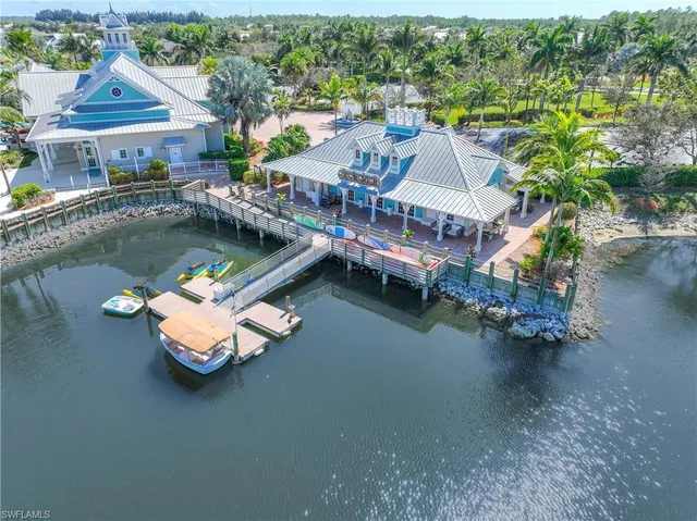 an aerial view of a house with swimming pool a yard and a terrace