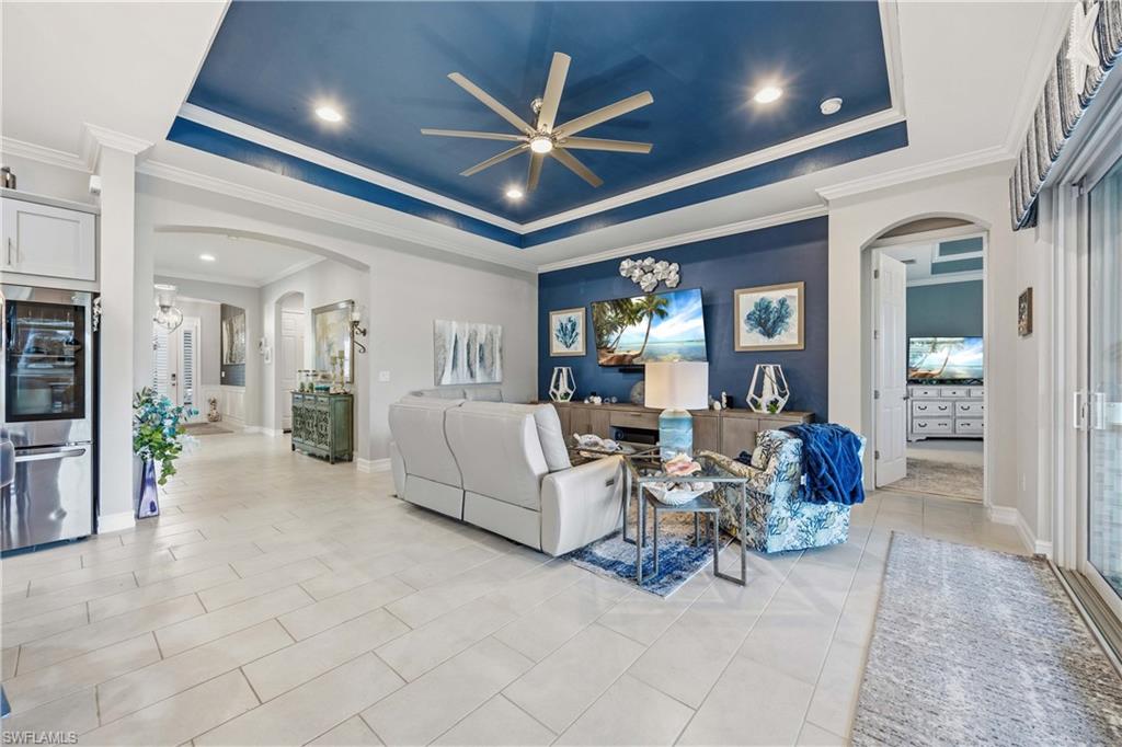 14748 Windward Lane Naples, FL 34114 - Photo 5 of 47 a living room with furniture and a ceiling fan