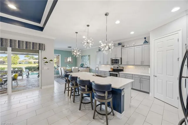 a large kitchen with a table and chairs