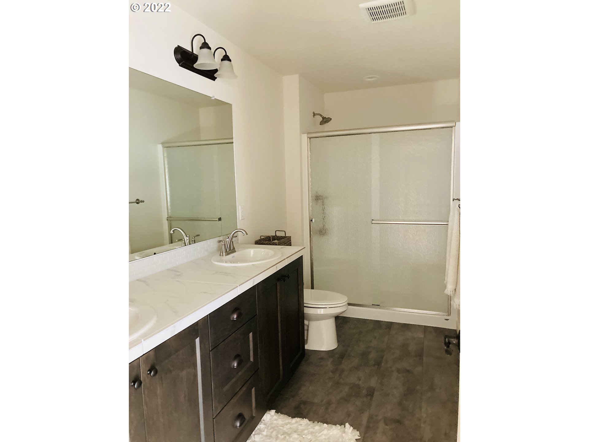 7138 South 11th Street Ridgefield, WA 98642 - Photo 11 of 14 a bathroom with a sink and a mirror