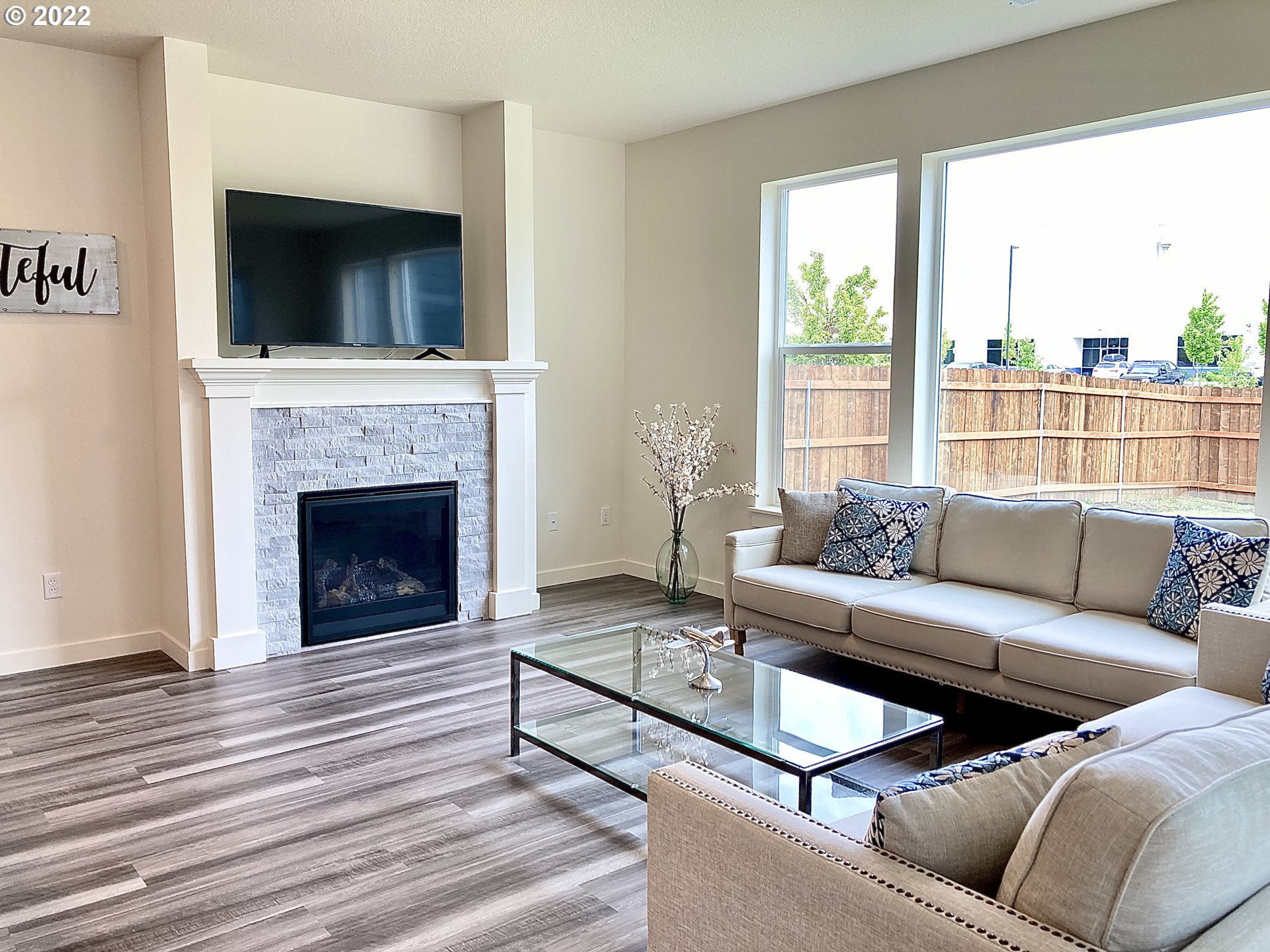 7138 South 11th Street Ridgefield, WA 98642 - Photo 3 of 14 a living room with furniture and a fireplace