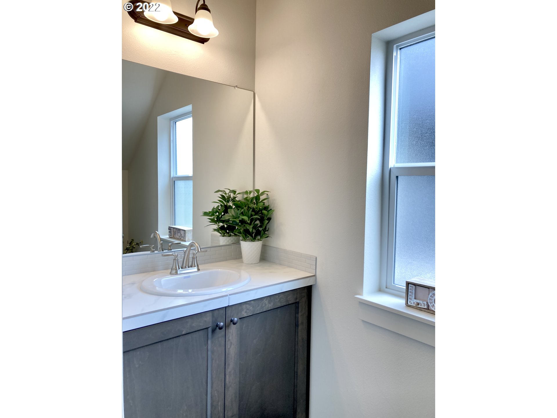 7138 South 11th Street Ridgefield, WA 98642 - Photo 7 of 14 a bathroom with a sink and a mirror