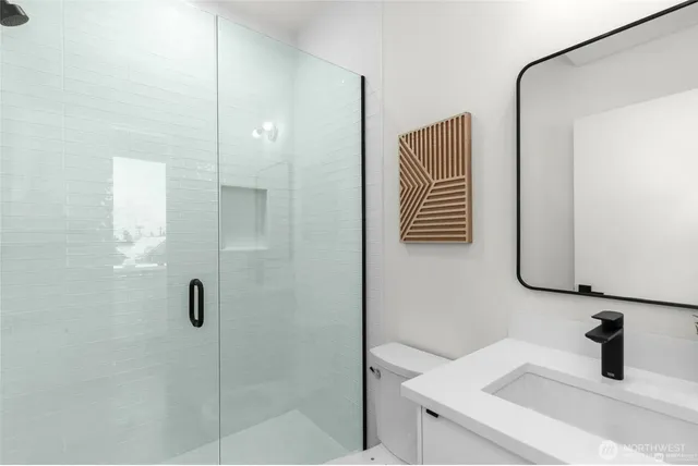 a bathroom with a sink and mirror