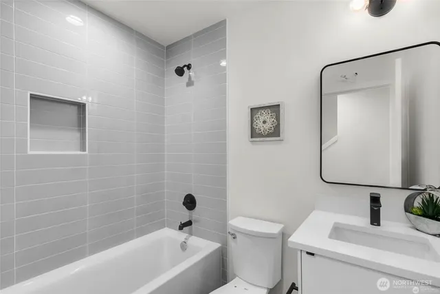 a bathroom with a toilet sink and shower