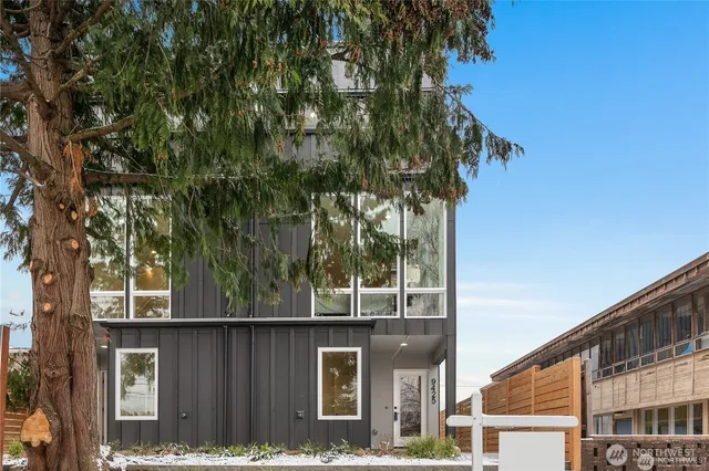 a view of a house with a tree