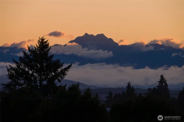 a view of sunset and a yard