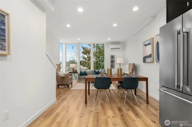 a view of a dining room with furniture window and wooden floor