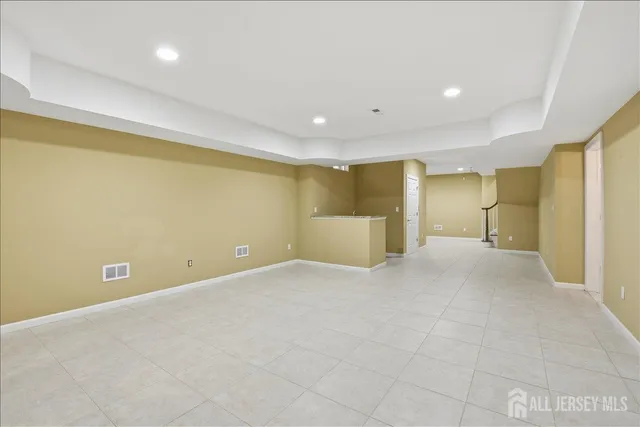 a living room with furniture a fireplace and a table