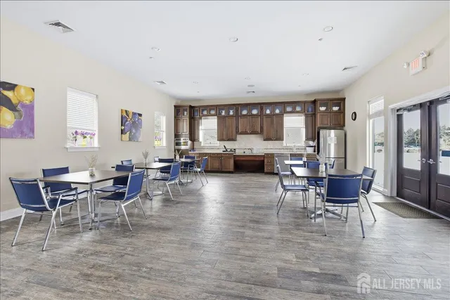 a bathroom with a toilet sink and a mirror