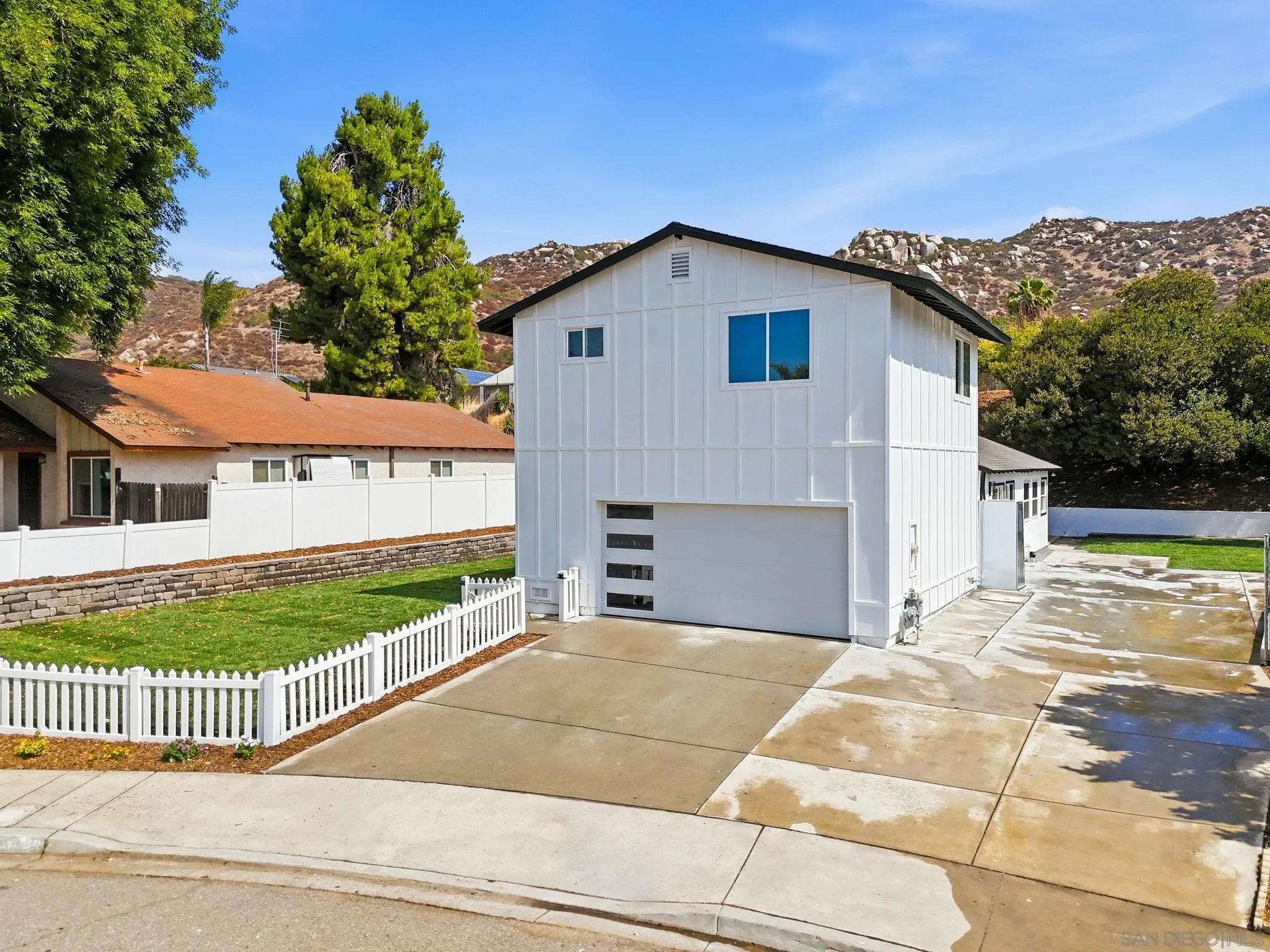 10440 Bosque Drive Lakeside, CA 92040 - Photo 3 of 47 a view of a house with a garden and pathway