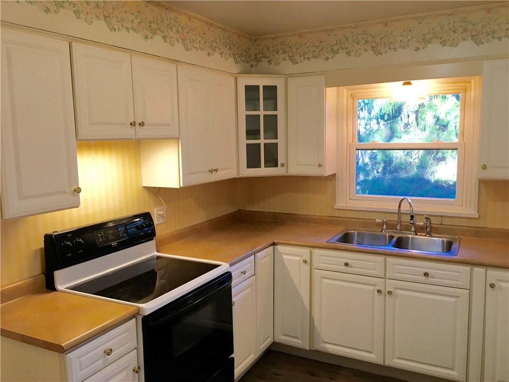 582 Weaver Mill Road Rector, PA 15677 - Photo 13 of 25 The Kitchen has ample cabinet space and the window to the back yard is ideal from the Kitchen sink. There is under-cabinet lighting, new flooring and a stainless steel double bowl sink.