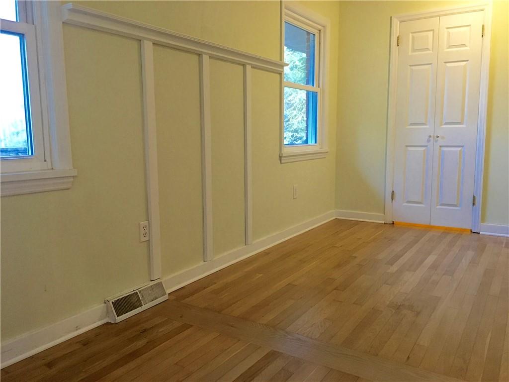 582 Weaver Mill Road Rector, PA 15677 - Photo 20 of 25 A view into the 10x14 owner's suite. Two windows to the back of the home, a walk-in closet and behind the photographer is a doorway leading to the full En-Suite Bath. Oak Hardwood Floor continue.