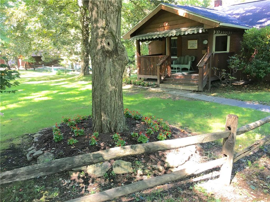 582 Weaver Mill Road Rector, PA 15677 - Photo 3 of 25 Beautiful landscaping touches and a great covered front Porch!