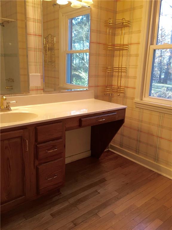 582 Weaver Mill Road Rector, PA 15677 - Photo 22 of 25 A view into the En-Suite Owner's Bath. There is a place to sit and get ready for a night out! The window on the right allows natural light in and a view to the side yard.