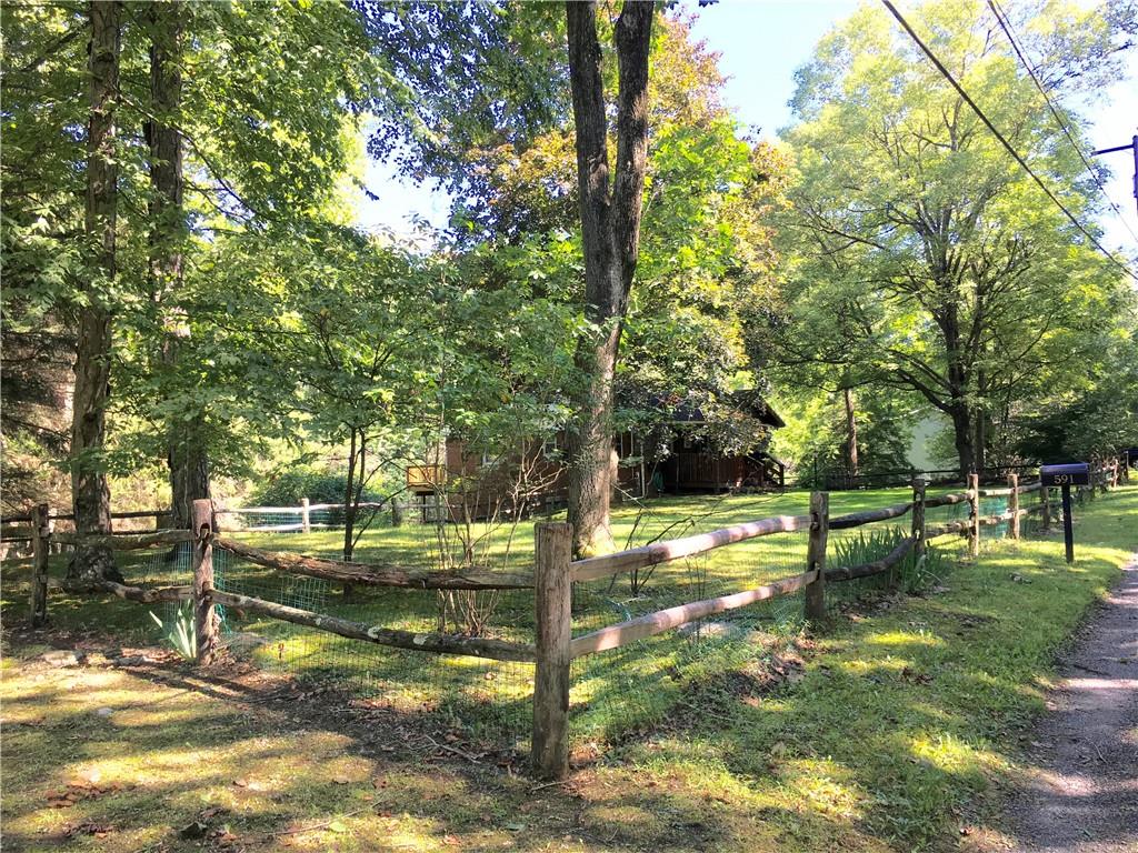 582 Weaver Mill Road Rector, PA 15677 - Photo 5 of 25 An additional angled photo from Weaver Mill Rd showing the size of the front yard and Post & Rail Fencing. There is a wire mesh to help keep in loved ones.