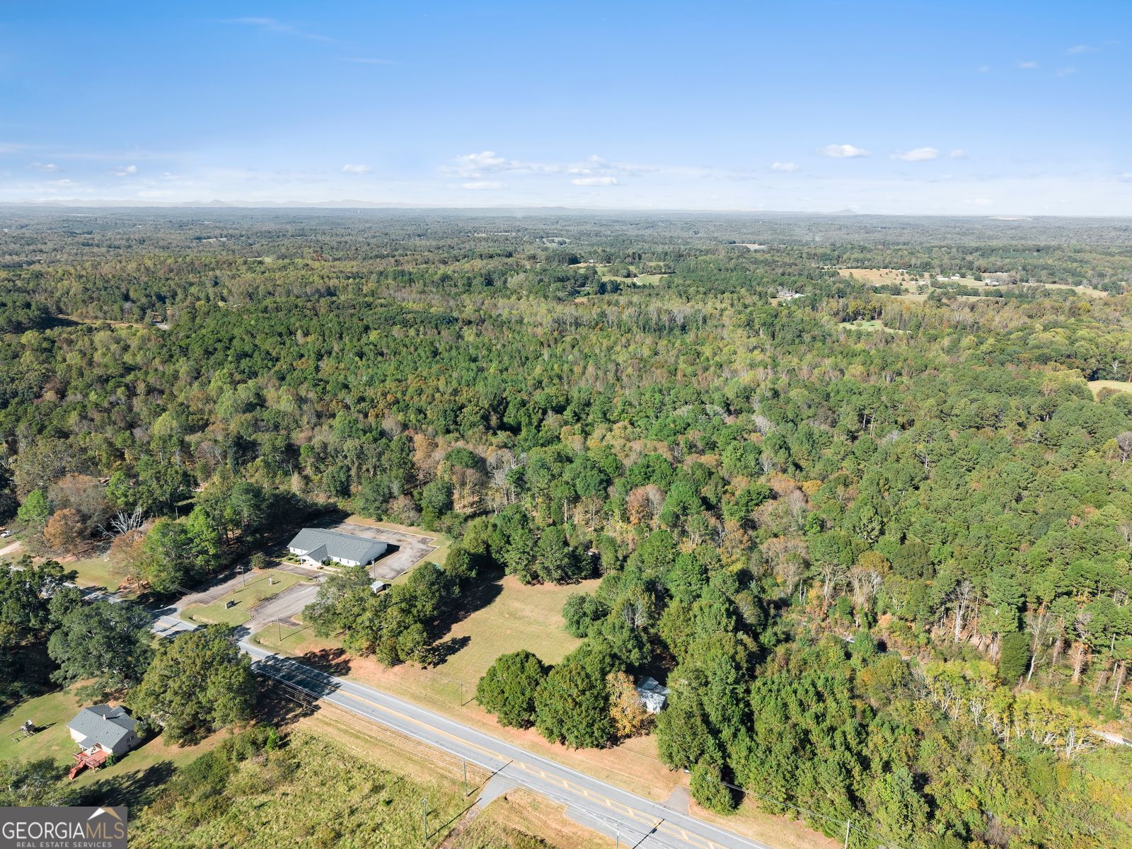 5830 Maysville Road Commerce, GA 30529 - Photo 11 of 12 an aerial view of residential houses with outdoor space
