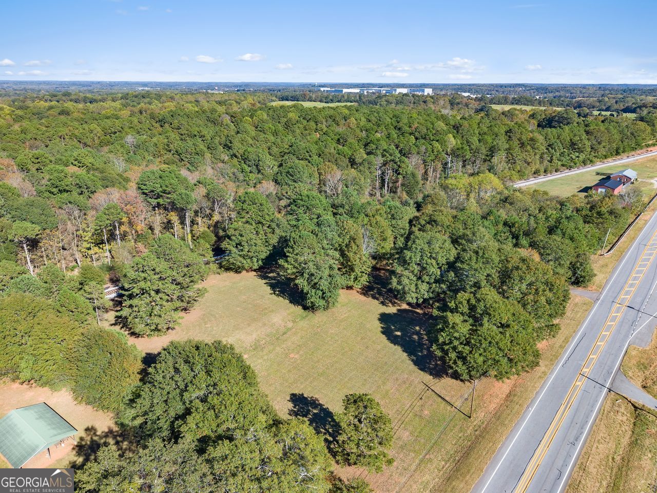 5830 Maysville Road Commerce, GA 30529 - Photo 7 of 12 a view of a lake with a yard