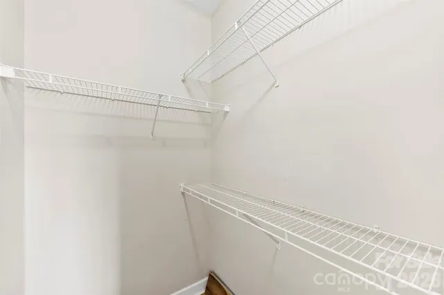 a view of a room with racks on the wall